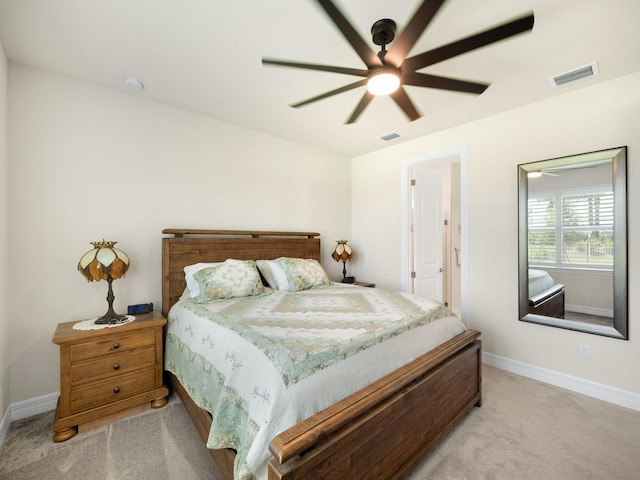 10621 SW Morning Glory Dr, Port Saint Lucie, FL 34987 - bedroom with light carpet, baseboards, and ceiling fan