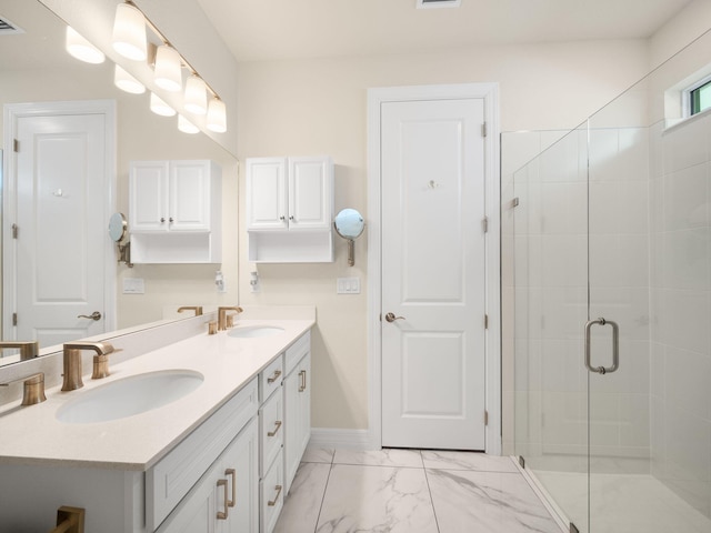 10621 SW Morning Glory Dr, Port Saint Lucie, FL 34987 - bathroom featuring double vanity, marble finish flooring, a stall shower, and baseboards