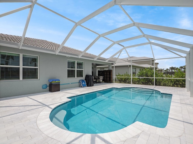 10621 SW Morning Glory Dr, Port Saint Lucie, FL 34987 - swimming pool featuring a patio area and glass enclosure