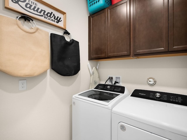 10621 SW Morning Glory Dr, Port Saint Lucie, FL 34987 - washroom with washer and clothes dryer and cabinet space