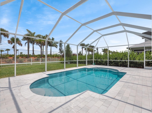 10621 SW Morning Glory Dr, Port Saint Lucie, FL 34987 - view of swimming pool featuring a patio, a yard, and glass enclosure