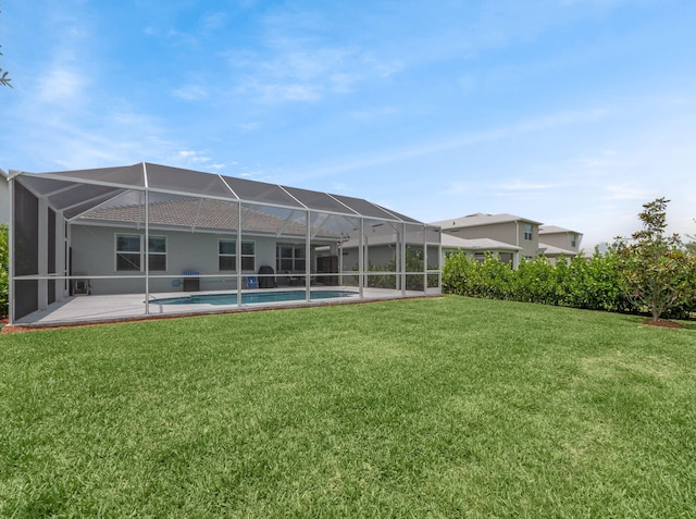 10621 SW Morning Glory Dr, Port Saint Lucie, FL 34987 - back of house featuring a yard, glass enclosure, stucco siding, and an outdoor pool