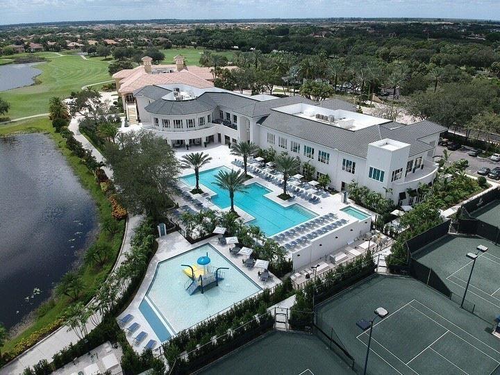 8877 Valhalla Dr, Delray Beach, FL 33446 - drone / aerial view of a pool area and a nearby body of water