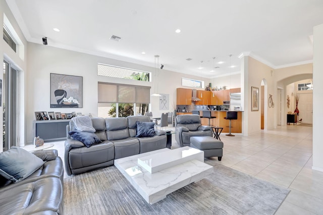 7181 Veneto Dr, Boynton Beach, FL 33437 - living room with arched walkways, light tile patterned flooring, ornamental molding, and recessed lighting