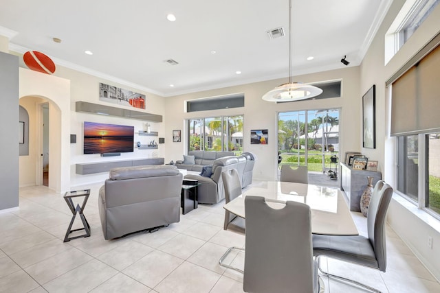 7181 Veneto Dr, Boynton Beach, FL 33437 - dining area with ornamental molding, arched walkways, recessed lighting, light tile patterned flooring, and baseboards