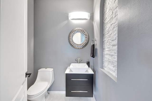 7181 Veneto Dr, Boynton Beach, FL 33437 - half bathroom with tile patterned flooring, vanity, and toilet