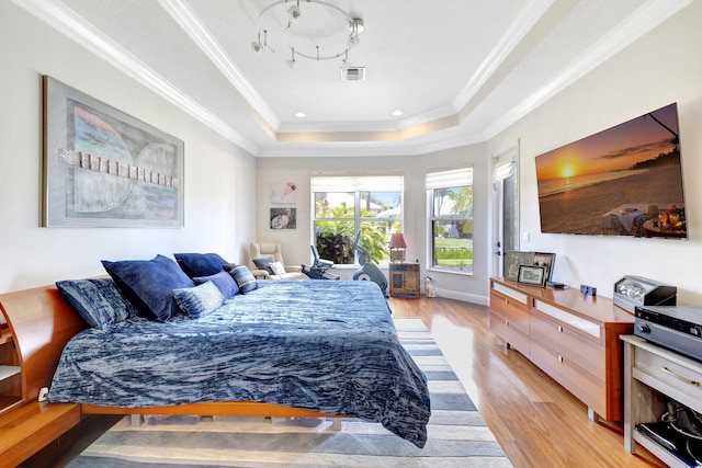 7181 Veneto Dr, Boynton Beach, FL 33437 - bedroom featuring a raised ceiling, light wood-style floors, and crown molding