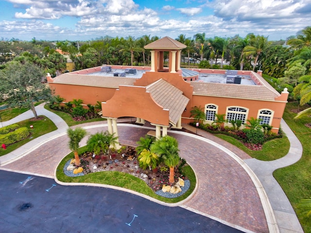 7181 Veneto Dr, Boynton Beach, FL 33437 - view of property featuring curved driveway