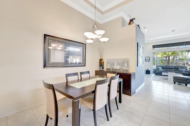 7181 Veneto Dr, Boynton Beach, FL 33437 - dining area featuring a chandelier, baseboards, a towering ceiling, light tile patterned floors, and crown molding