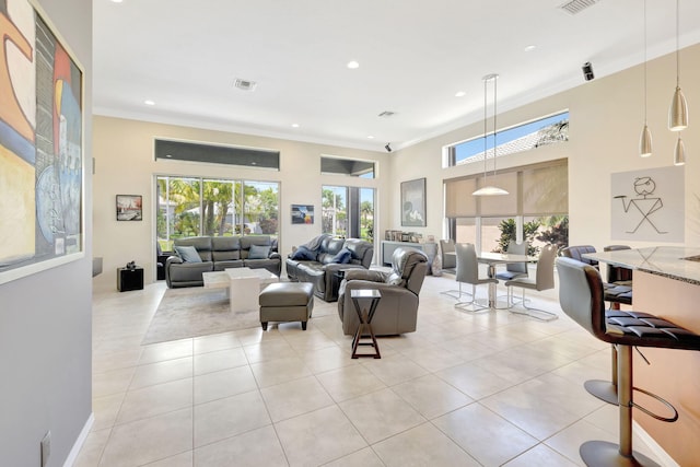7181 Veneto Dr, Boynton Beach, FL 33437 - living room featuring plenty of natural light, light tile patterned flooring, crown molding, recessed lighting, and a high ceiling