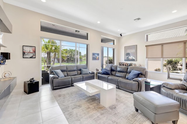 7181 Veneto Dr, Boynton Beach, FL 33437 - living room featuring crown molding, light tile patterned floors, plenty of natural light, recessed lighting, and a high ceiling