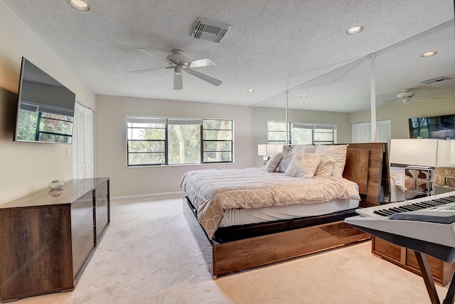 18 Westgate Ln Unit 18F, Boynton Beach, FL 33436 - bedroom featuring multiple windows, light carpet, recessed lighting, baseboards, and a textured ceiling