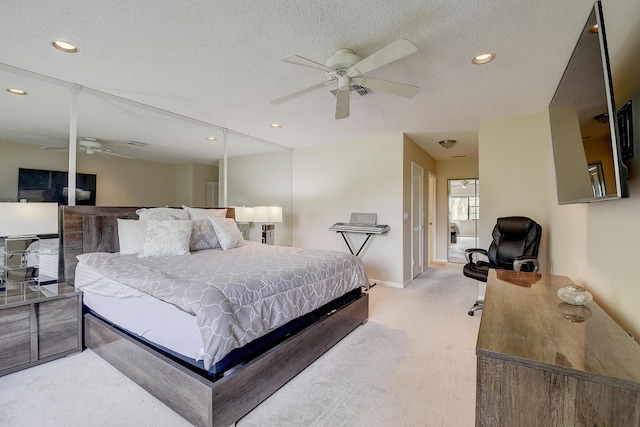 18 Westgate Ln Unit 18F, Boynton Beach, FL 33436 - bedroom featuring light colored carpet, recessed lighting, baseboards, a textured ceiling, and a ceiling fan
