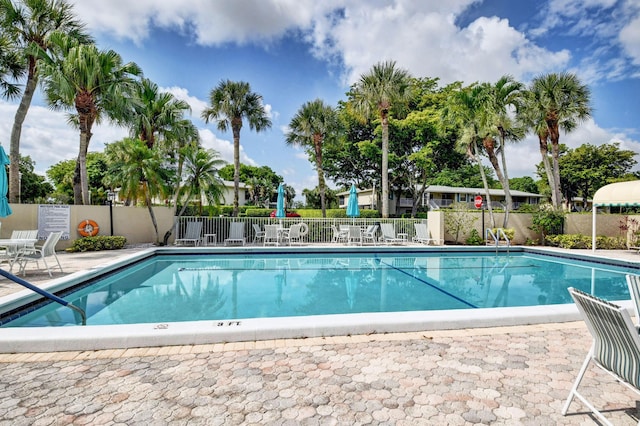 18 Westgate Ln Unit 18F, Boynton Beach, FL 33436 - community pool featuring a patio area