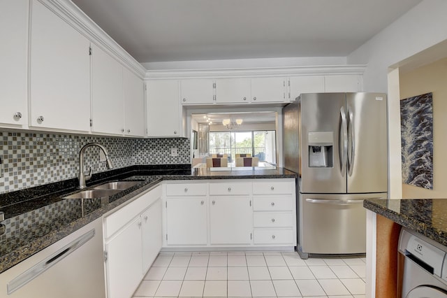 18 Westgate Ln Unit 18F, Boynton Beach, FL 33436 - kitchen featuring stainless steel fridge, dishwashing machine, a sink, white cabinetry, and backsplash