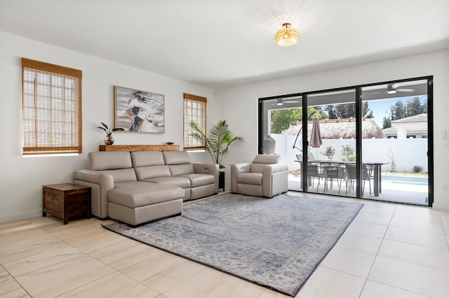 7102 Rockwood Rd, Jupiter, FL 33458 - tiled living area featuring baseboards and a ceiling fan
