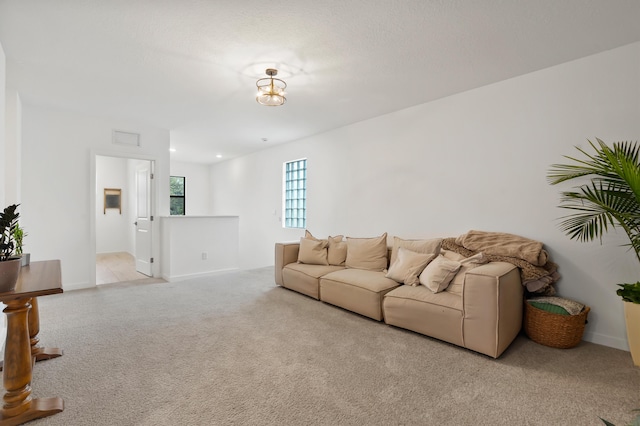7102 Rockwood Rd, Jupiter, FL 33458 - carpeted living area featuring baseboards