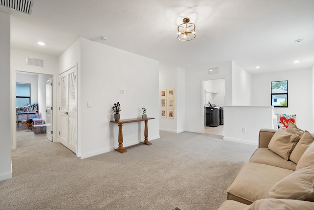 7102 Rockwood Rd, Jupiter, FL 33458 - living room with light carpet, baseboards, and recessed lighting