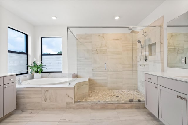 7102 Rockwood Rd, Jupiter, FL 33458 - bathroom with vanity, marble finish floors, a bath, a stall shower, and recessed lighting
