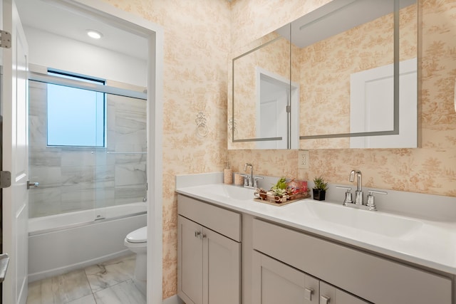 7102 Rockwood Rd, Jupiter, FL 33458 - full bath with toilet, double vanity, bath / shower combo with glass door, wallpapered walls, and marble finish floors
