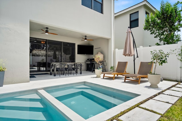 7102 Rockwood Rd, Jupiter, FL 33458 - rear view of property featuring a ceiling fan, a patio, stucco siding, and a pool with connected hot tub