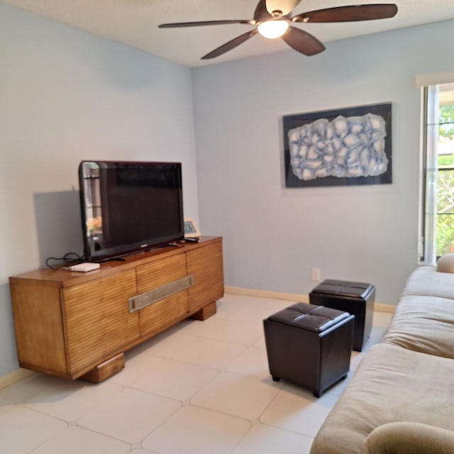 10231 N Circle Lake Dr Unit 101, Boynton Beach, FL 33437 - living room featuring ceiling fan and light flooring