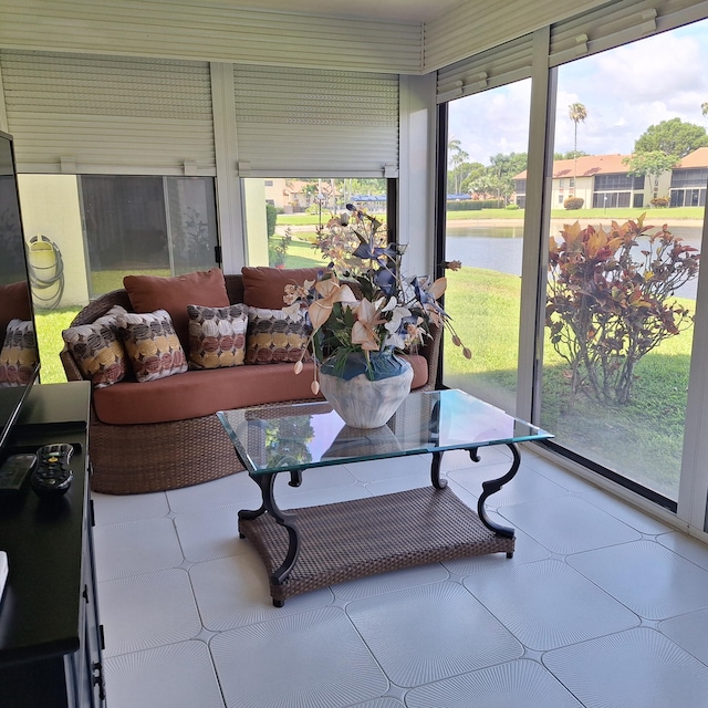 10231 N Circle Lake Dr Unit 101, Boynton Beach, FL 33437 - sunroom featuring a water view, tile patterned floors, and an outdoor hangout area