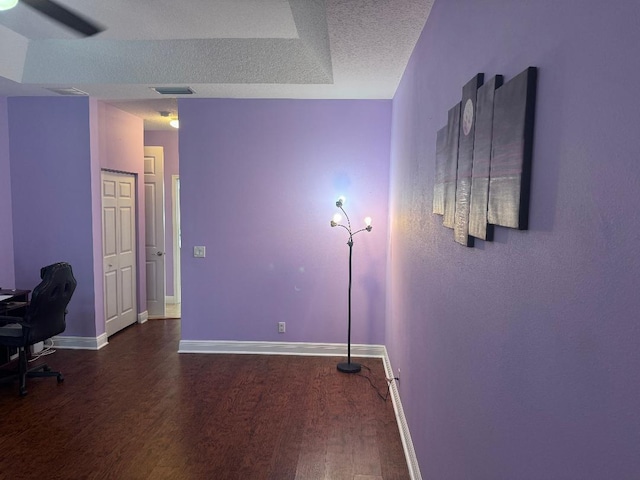 5760 NW Cleburn Dr, Port Saint Lucie, FL 34986 - unfurnished office featuring dark wood-type flooring, baseboards, and a textured ceiling