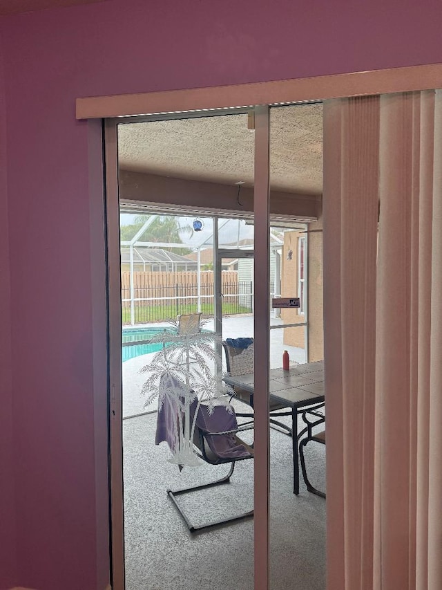 5760 NW Cleburn Dr, Port Saint Lucie, FL 34986 - entryway with carpet floors and a textured ceiling