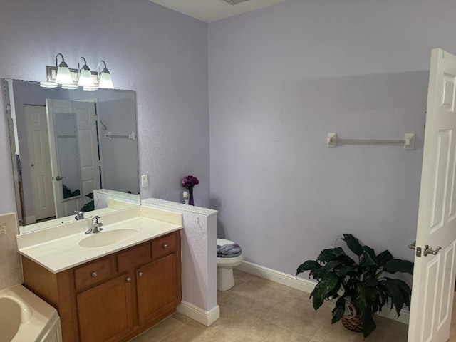5760 NW Cleburn Dr, Port Saint Lucie, FL 34986 - bathroom with vanity, a tub to relax in, tile patterned floors, toilet, and baseboards
