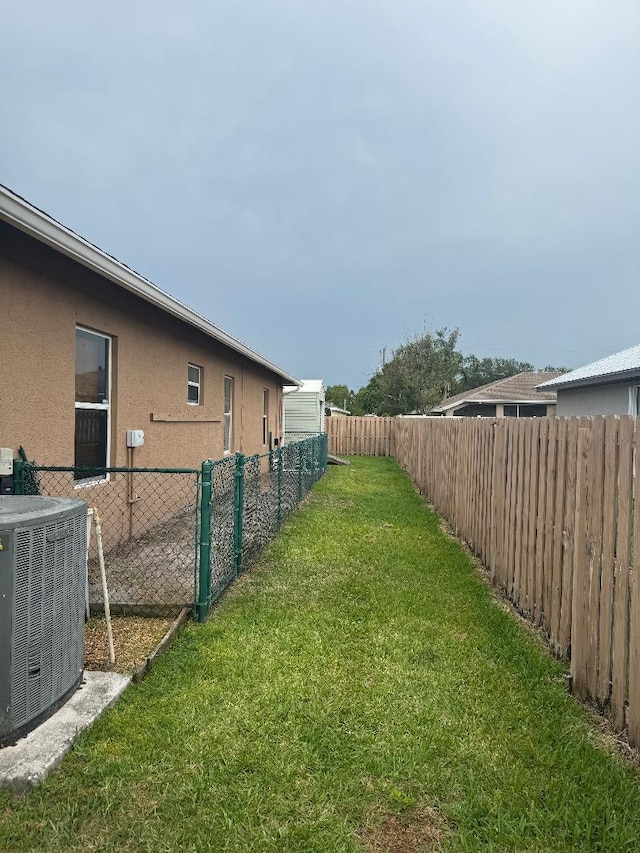 5760 NW Cleburn Dr, Port Saint Lucie, FL 34986 - view of yard with central AC