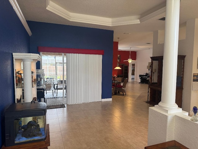 5760 NW Cleburn Dr, Port Saint Lucie, FL 34986 - tiled foyer with decorative columns, crown molding, a ceiling fan, and a raised ceiling