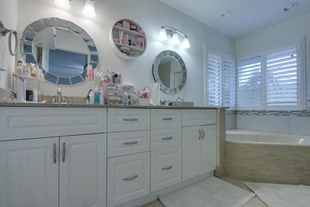 1855 Lotus Ln, Wellington, FL 33414 - full bathroom featuring double vanity, a garden tub, and tile patterned flooring