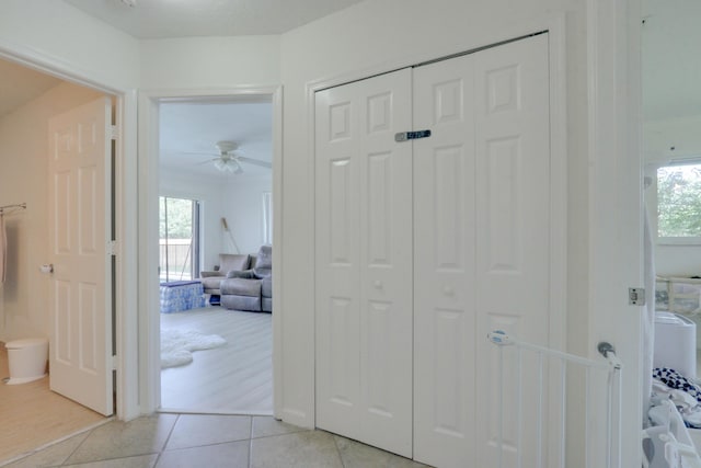 1855 Lotus Ln, Wellington, FL 33414 - corridor featuring light tile patterned floors