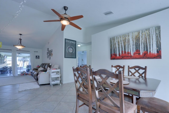 1855 Lotus Ln, Wellington, FL 33414 - dining area with ceiling fan, light tile patterned flooring, high vaulted ceiling, and baseboards