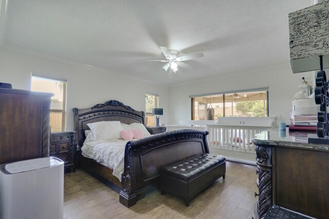 1855 Lotus Ln, Wellington, FL 33414 - bedroom featuring wood finished floors, crown molding, and ceiling fan