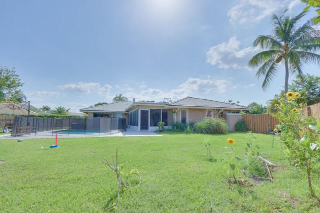 1855 Lotus Ln, Wellington, FL 33414 - rear view of property featuring a sunroom