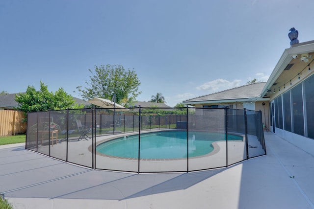 1855 Lotus Ln, Wellington, FL 33414 - view of pool with a fenced backyard and a patio