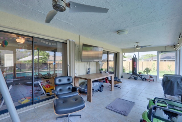 1855 Lotus Ln, Wellington, FL 33414 - sunroom / solarium featuring ceiling fan, a textured ceiling, and tile patterned flooring