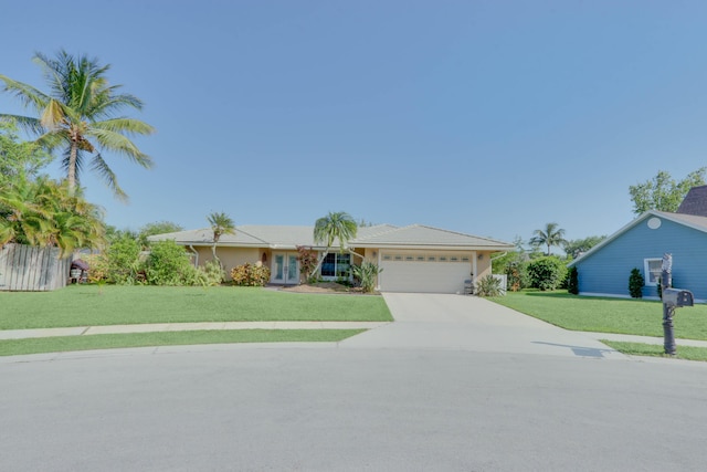1855 Lotus Ln, Wellington, FL 33414 - ranch-style house featuring an attached garage, concrete driveway, and a front yard