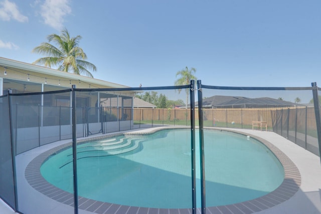 1855 Lotus Ln, Wellington, FL 33414 - view of pool with a fenced backyard