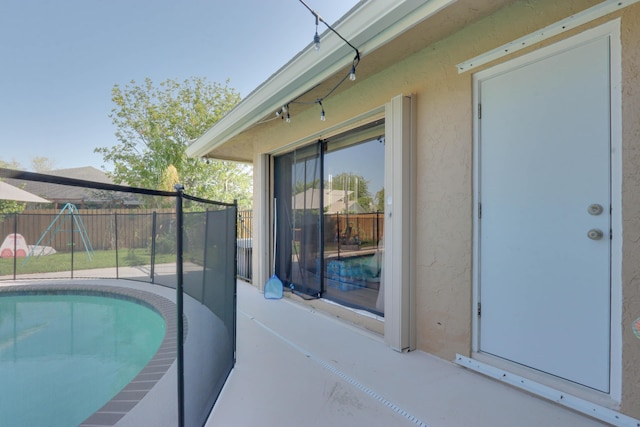 1855 Lotus Ln, Wellington, FL 33414 - view of pool featuring a playground and a patio area