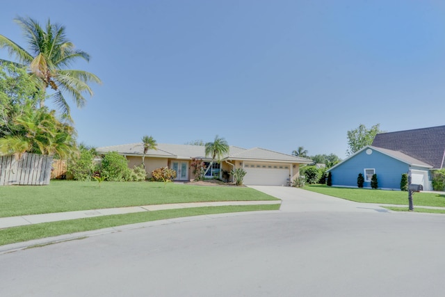 1855 Lotus Ln, Wellington, FL 33414 - single story home with an attached garage, concrete driveway, and a front lawn