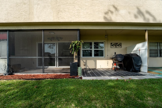 9500 SW 3rd St SW Unit 130, Boca Raton, FL 33428 - doorway to property with a yard, a patio, and stucco siding