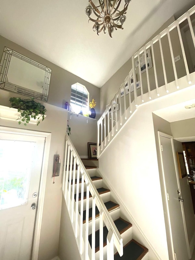 5473 E Berry Blossom Way E, West Palm Beach, FL 33415 - stairs featuring a chandelier