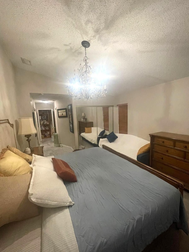 5473 E Berry Blossom Way E, West Palm Beach, FL 33415 - bedroom with a textured ceiling and a chandelier