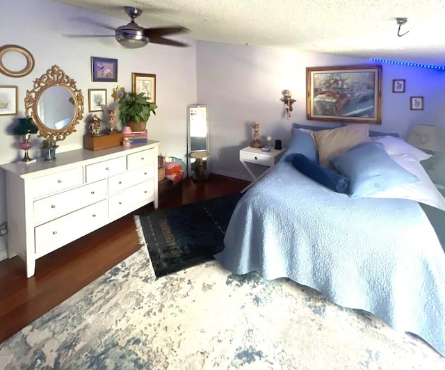 5473 E Berry Blossom Way E, West Palm Beach, FL 33415 - bedroom with wood finished floors, a textured ceiling, and ceiling fan