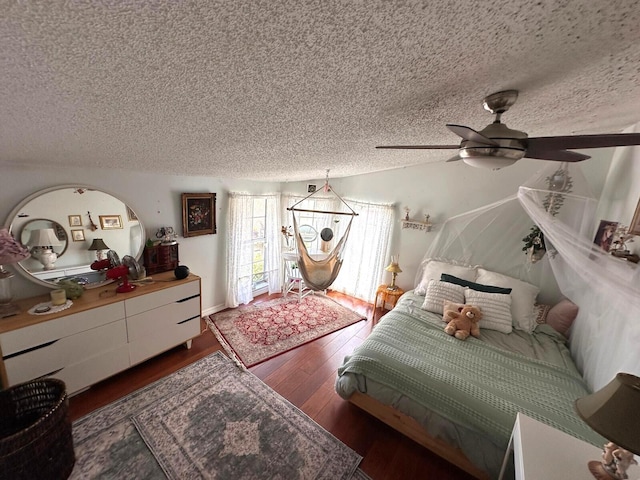 5473 E Berry Blossom Way E, West Palm Beach, FL 33415 - bedroom featuring a textured ceiling, wood finished floors, and ceiling fan