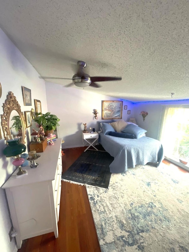 5473 E Berry Blossom Way E, West Palm Beach, FL 33415 - bedroom featuring a textured ceiling, wood finished floors, vaulted ceiling, and ceiling fan