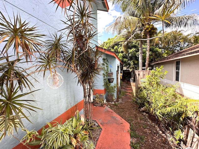 5473 E Berry Blossom Way E, West Palm Beach, FL 33415 - view of property exterior featuring stucco siding